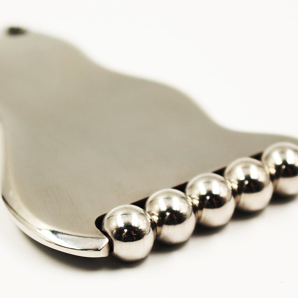 Five-Ball Stainless Steel Gua Sha Board In use